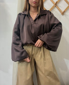 Blusa satinata testa di moro bombata con elastico sul fondo