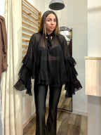 Blusa velata nera manica a pipistrello